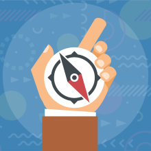 Hand holding compass